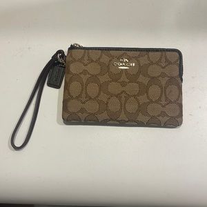 Small coach wristlet in blocked signature jacquard